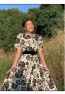 Damen-Neckholderkleid mit Blumenmuster und Gürtel